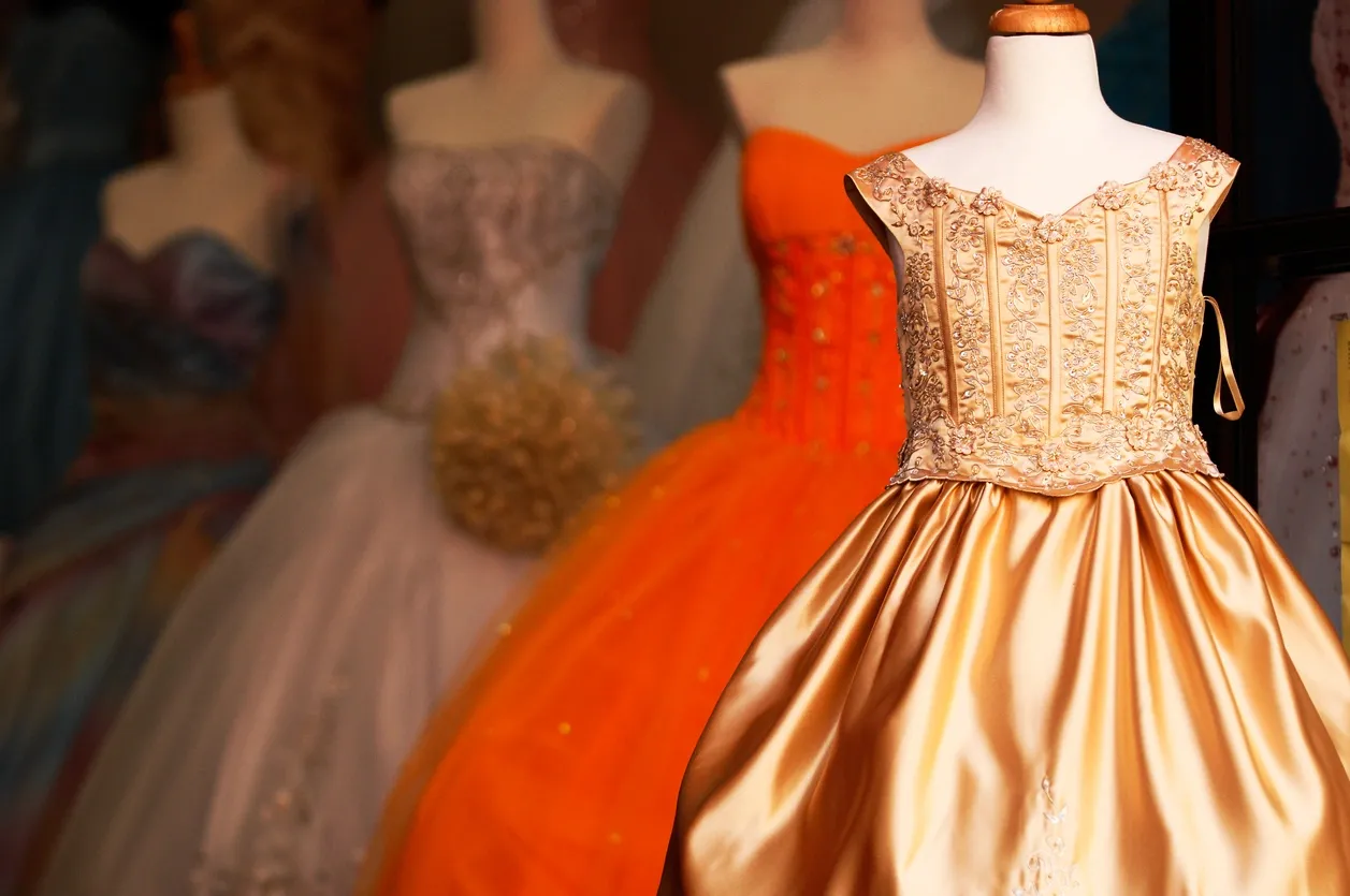 Why do Quinceanera dresses come with a hooped skirt?